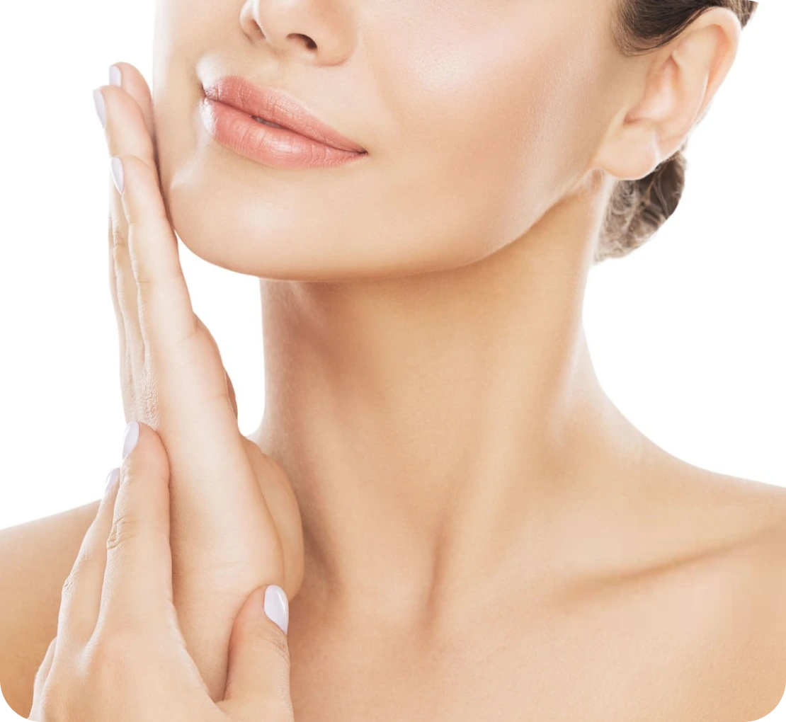 Woman touching her face, showing clear, smooth skin
